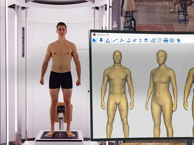 A photo of a 3D body scanner and display of resulting computer renderings
