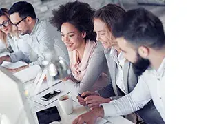 People training in a room with laptops